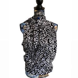 American City Wear, sleeveless mock tie-neck blouse.